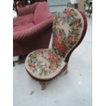 A mid Victorian chair having beadwork and woolwork upholstery on gilt effect legs