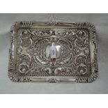 A silver dressing table tray having moulded scroll decoration, plain cartouche and moulded rim,