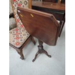 A 19th century mahogany pedestal table having square canted top on reeded column and triple splay