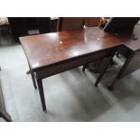 A 19th century mahogany carved table having rectangular fold over top on reeded gate legs