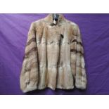 An interesting 1980s fur coat having blouson bodice and different fur pelts used on sleeves, good