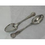 A pair of Victorian silver table spoons having moulded scallop shell decoration to terminals and