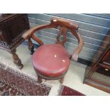 A 19th century mahogany clerks chair having bow back, later upholstered circular seat and stub legs