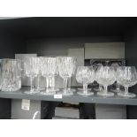 A selection of fine clear cut Waterford crystal wine and brandy glasses with water jug including