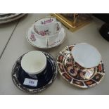 A Mintons cabinet cup and saucer having silver overlay, a Royal Crown Derby cabinet cup and saucer