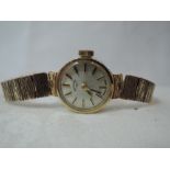 A lady's 9ct gold wrist watch by Rotary having a baton numeral dial to circular face on a