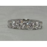 A lady's dress ring having four diamonds, total approx 2ct in a claw set raised mount on a