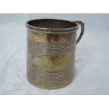 A small silver tankard having reeded decoration and monogram DB, Birmingham 1918, S W Smith & Co