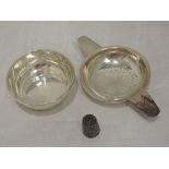 A silver tea strainer with saucer, of plain quiache form, Birmingham 1960, Elkington & Co, and a Vi