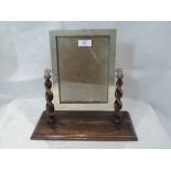 A silver photograph frame of rectangular form on an oak swing stand, Birmingham 1925, Sanders &