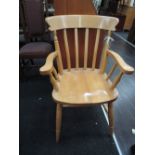 A beech wood dining or carver chair