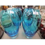 Four blue glass vases