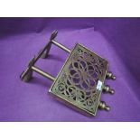 A 19th century brass trivet/kettle stand of adjustable design