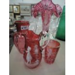 A selection of cranberry glass including Mary Gregory style