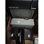 A box of photography equipment includes a Diastar 200 slide projecror, Minolta camera , Kodak