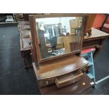 An Edwardian mahogany toilet swing mirror having three drawers