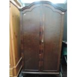 A mid/late 20th century mahogany Queen Anne style wardrobe having arch top and cabriole legs