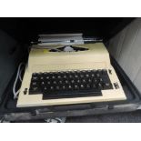 A cased electric typewriter