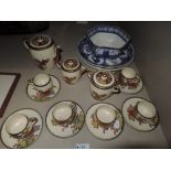A Satsuma pottery tea service having floral Chrysanthemum decoration and a selection of Ringtons