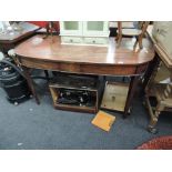 An early 19th century George III mahogany D end side table on tapered legs