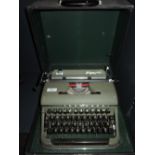 A vintage typewriter by Olympia in olive green