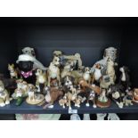 A selection of boxer dog figures and similar items