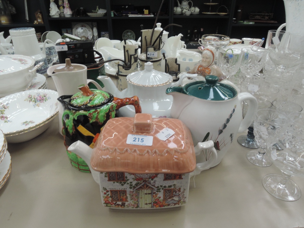 A selection of teapots and jugs including Poole