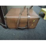 A leather travel trunk