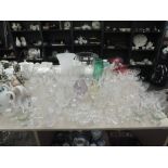 A large selection of cut glass and crystal glasses, vases and sundae dishes etc