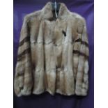 An interesting 1980s fur coat having blouson bodice and different fur pelts used on sleeves, good