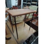 A Yew or similar wood topped and brass legged table