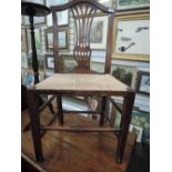 An oak framed and rush seated chair