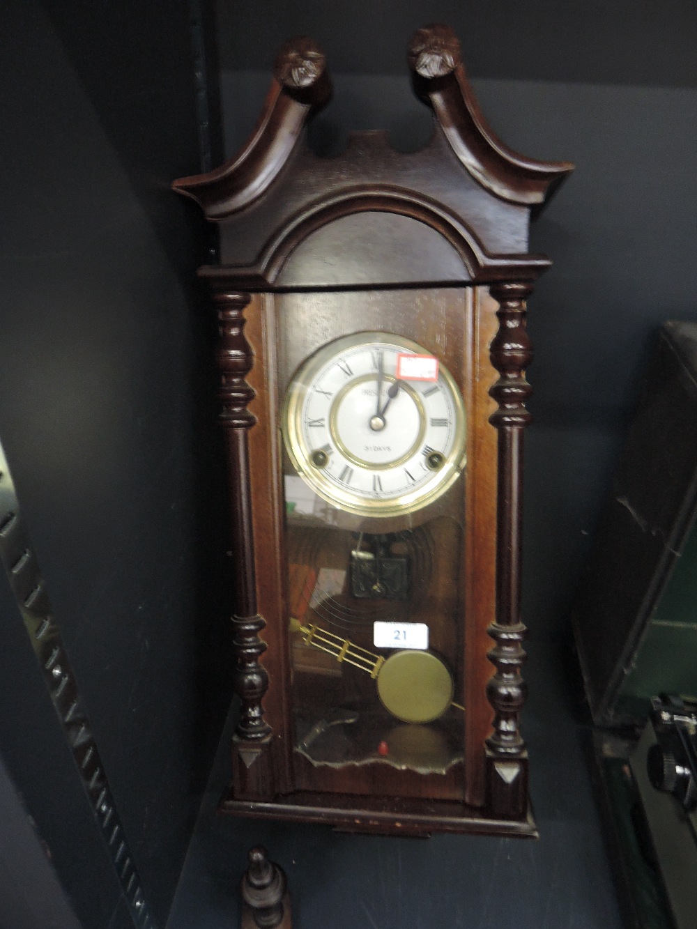 A reproduction wall clock with enamel face dial by President