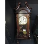 A reproduction wall clock with enamel face dial by President