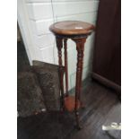 A late 20th century stained frame reproduction jardiniere stand on twist legs