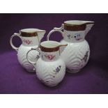 A set of three graduated Coalport jugs in the Copy Caughly Mask Head design