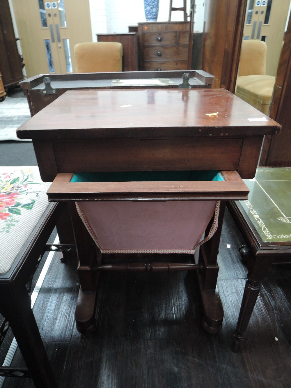 A mid 19th century mahogany serving tablle having ferctangular top with pull drawer on square
