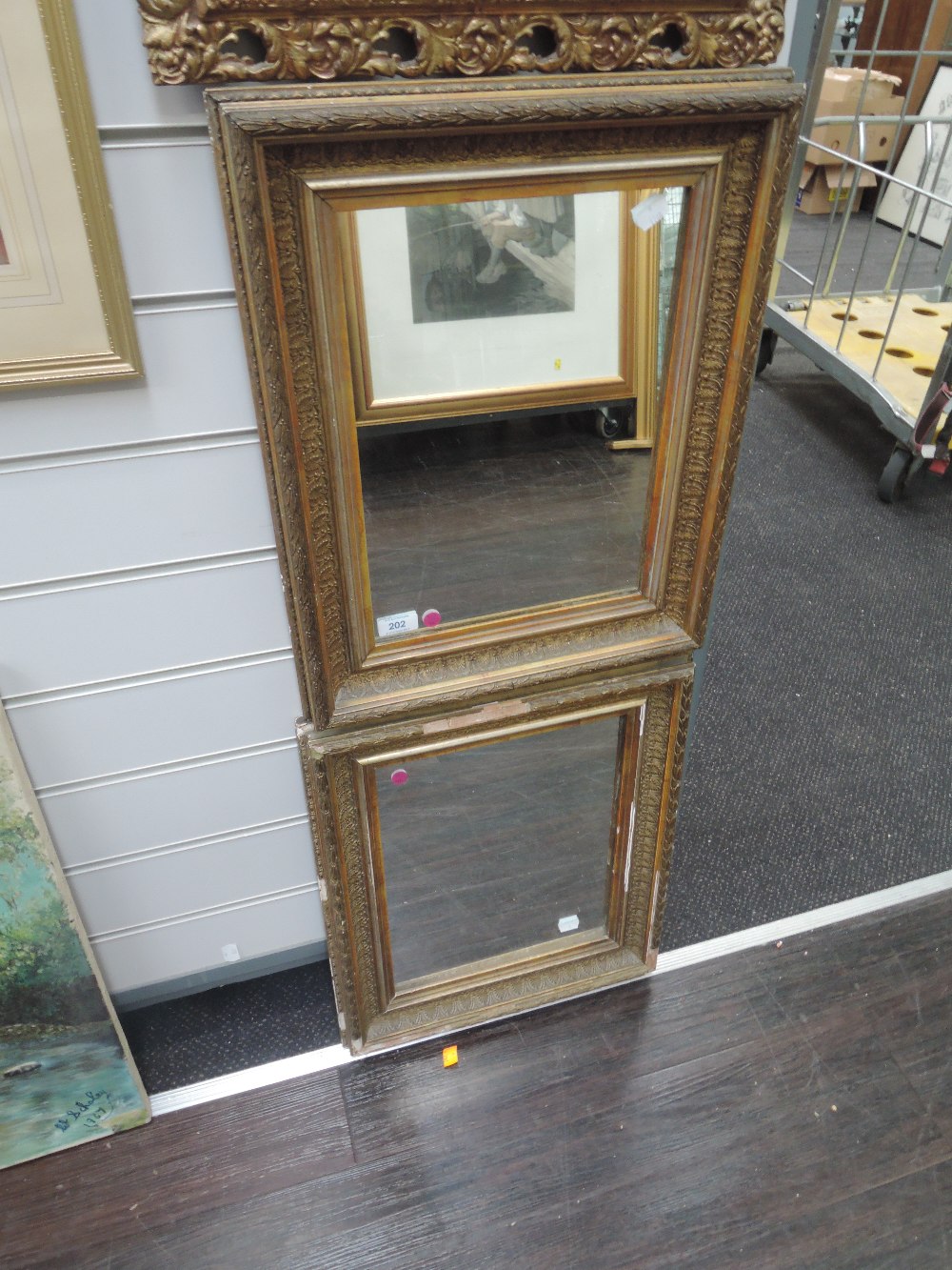 A pair of gilt and plaster framed mirrors