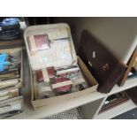 A boxed dressing table set and a leather clutch bag