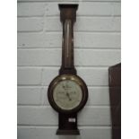 A wall mounted barometer by Short and Mason