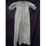 Victorian christening gown having intricate detailing and embroidery.