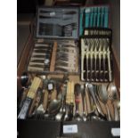 A large selection of boxed and loose flatware