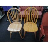 Two beech wood style hoop backed dining chairs