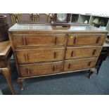 A side board of six drawers in oak