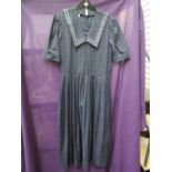 Vintage Laura Ashley navy blue dress having sailor collar and polka dot print. Good condition,