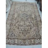 A mid/late 20th century carpet square in the Eastern style having cream ground, 220 x 154cm