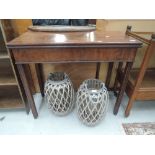 A 19th century mahogany card table having rectangular fold over top on reeded gate legs
