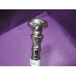 An Indian style wooden walking stick having a white metal moulded knop, unscrews into three pieces