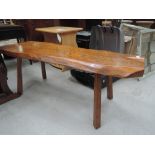 A rustic wood bench seat