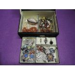 A jewellery box containing a selection of costume jewellery including silver plated clover leaf